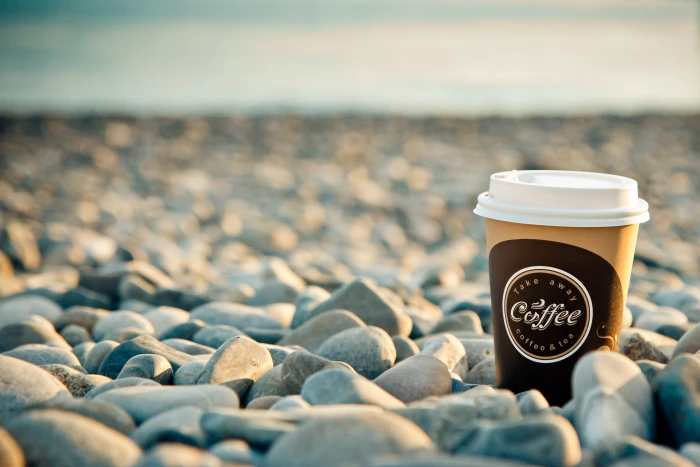 Coffee cup on stones sea morning breakfast beach good 2k 4k 5k