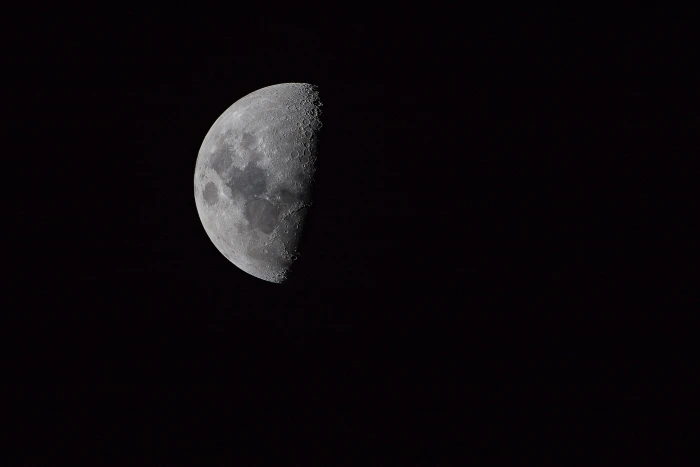 half moon on pitch dark sky photography of planet black and white 2k 4k 5k