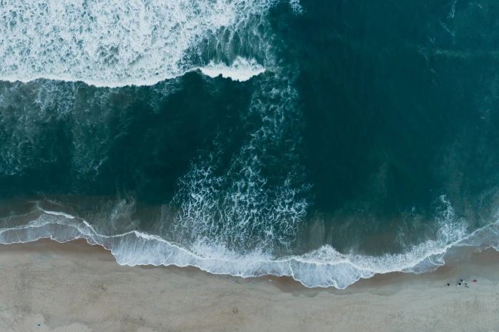 teal seawaves on seashore top angle view photography of beach 2k 4k