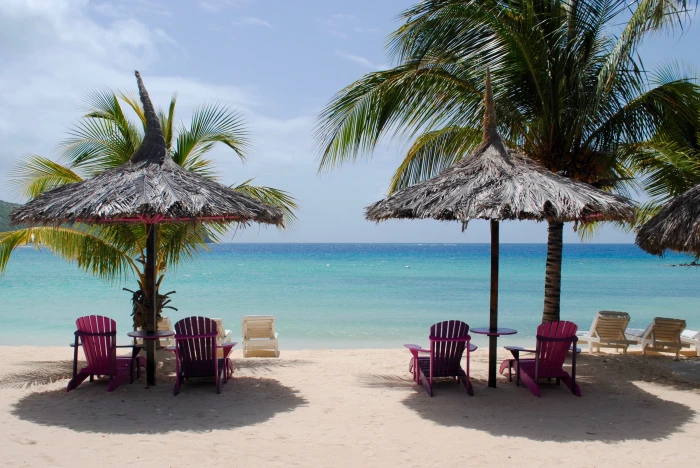 two brown parasols and four adirondacks chairs caribbean beach 2k 4k