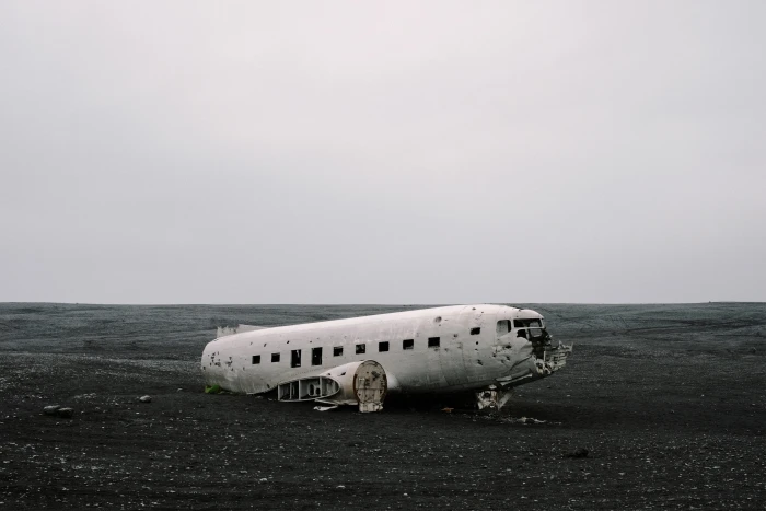 wrecked air plane on gray sand crashed white airplane beach 2k 4k