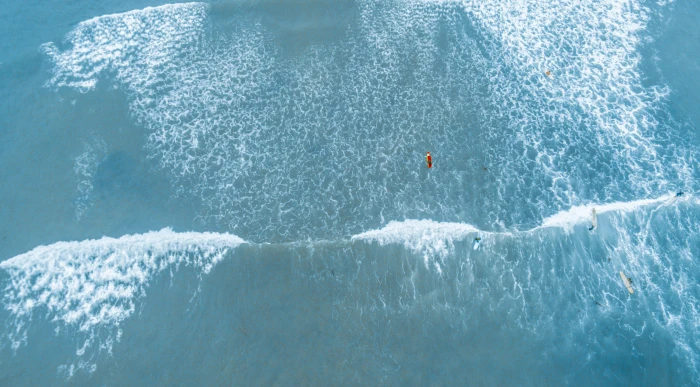 aerial photography of barrel wave top view body water 2k 4k