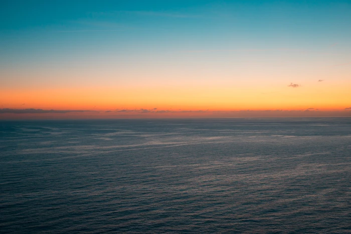 Beautiful Sunset over the Ocean background blue calm evening 2k 4k 5k