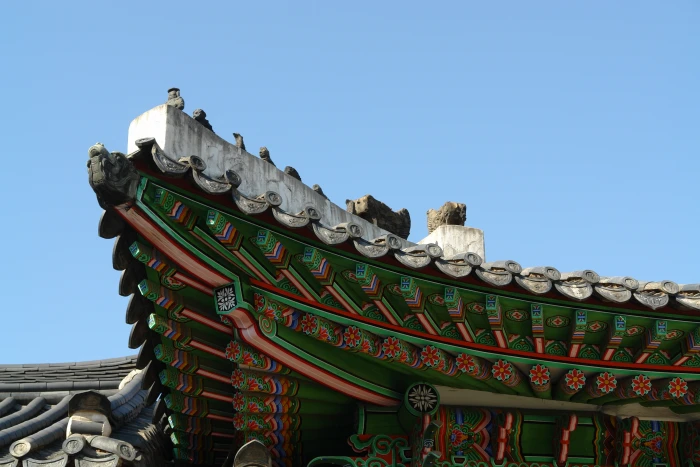 green and red concrete building under blue skies roof tile republic of korea 2k
