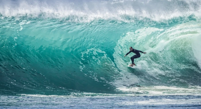 Riding the North Beach waves man surfing on big wave surfer 2k 4k 5k