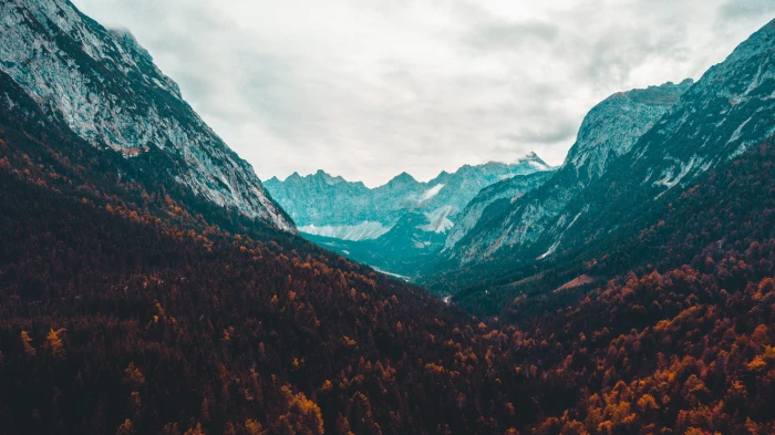 Scenic View Of Mountains Under Cloudy Sky wallpaper clouds 2k 4k