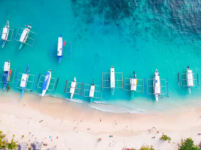 Seven Commando Beach El Nido Palawan speedboats on seashore 2k 4k