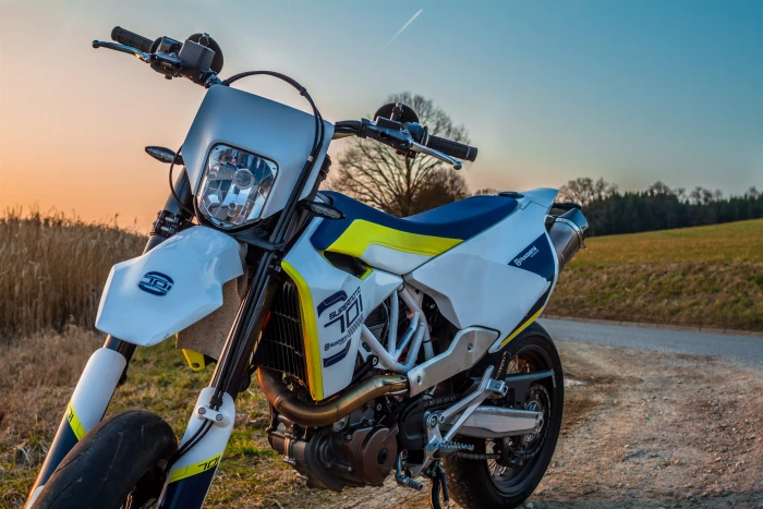 white and yellow dirt bike parked near green fields motorcycle 2k 4k 5k