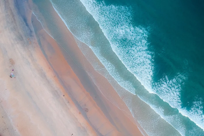Aerial Shot Of Ocean beach bird s eye view from above sand 2k 4k