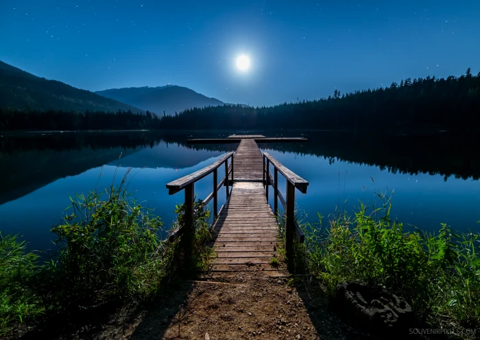 brown wooden dock on body of water during nighttime No Hurry 2k 4k 5k