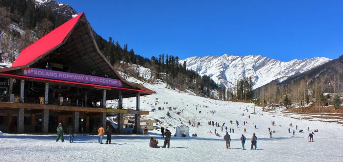 group of people near Solang Ropeway Ski Center during daytime 2k 4k 5k