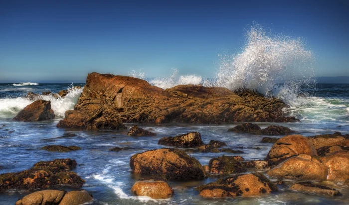sea wave splashing on brown rock during daytime Crash Surf 2k 4k 5k