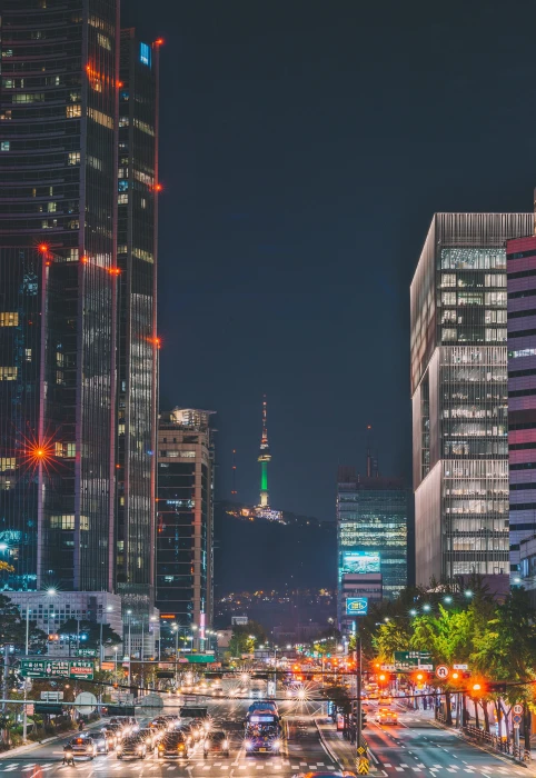 car passing through road beside building city night street 2k