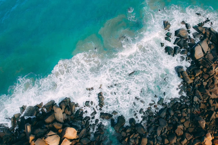 Top View Photo of Rocky Shore wallpaper beach bird s eye view 2k 4k