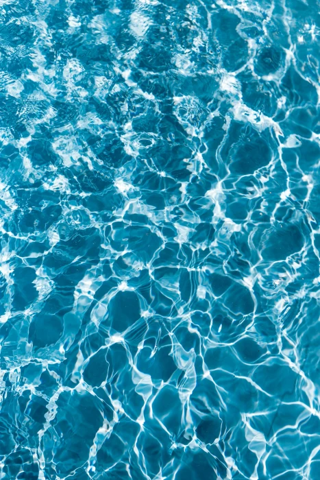 Wavy water surface in a swimming pool wave abstract background 2k 4k