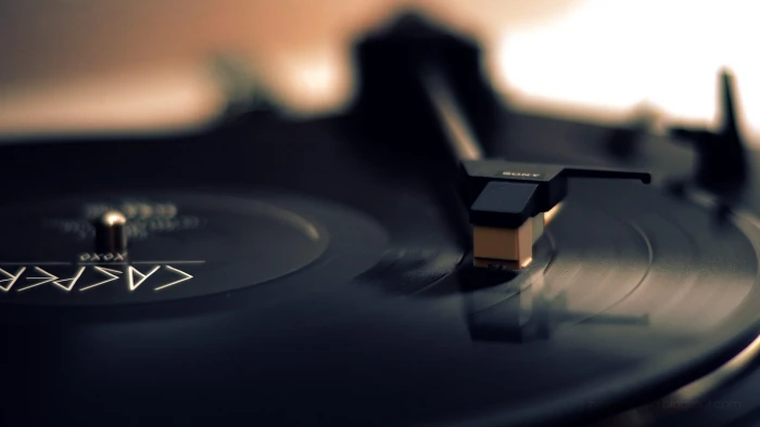 black Sony turntable and brown turntables vinyl 2k