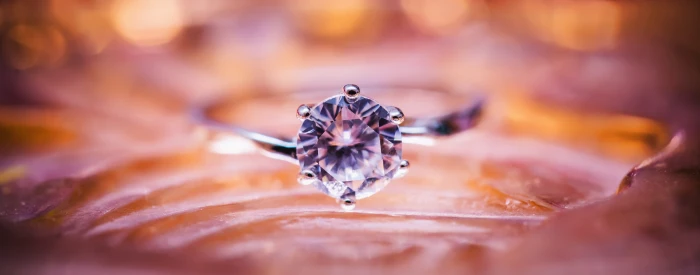 selective focus photography of silver ring with round cut diamond gemstone 2k 4k 5k