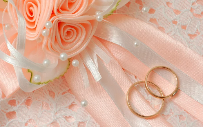 two gold colored marriage rings macro flowers bow wedding 2k