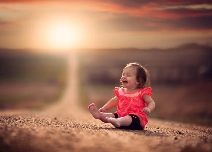 Baby girl laughter road bokeh 2k