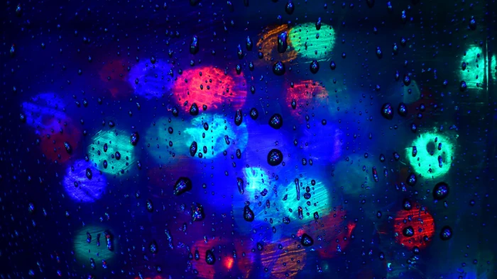 bokeh lights closeup photo of green red and blue with water drops 2k