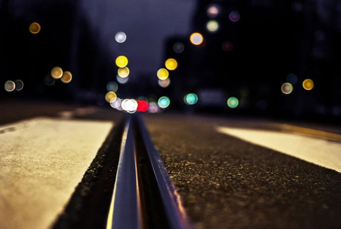 bokeh photography of road low angle with lights background 2k 4k