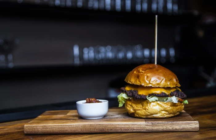 burger with meat and lettuce food bokeh blur wooden table 2k 4k 5k