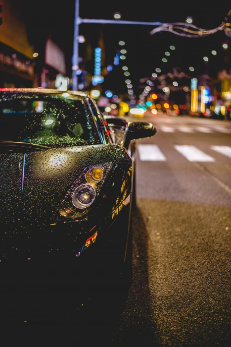close photography of black convertible on road Lamborghini with water drops during night time 2k 4k 5k