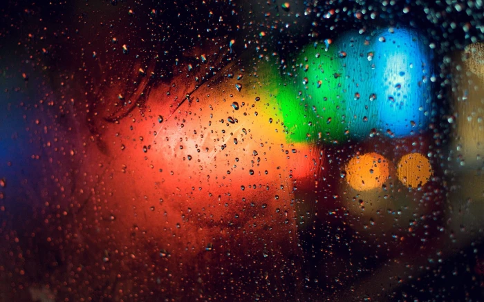 colorful water drops on glass blurred bokeh lights 2k