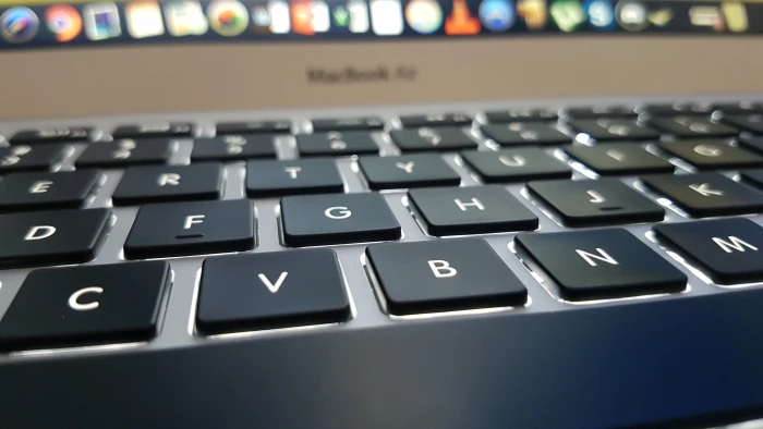 turned on MacBook Air computer laptop desktop letters keyboard 2k 4k
