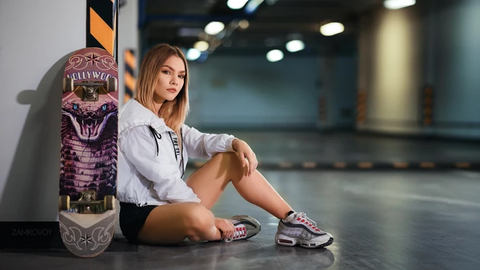 women model looking at viewer skateboard jacket white 2k