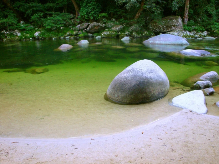 calm body of water with rocks surrounded trees stone about 2k 4k