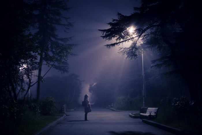 person looking at street lamp woman standing in front of utility post 2k 4k 5k