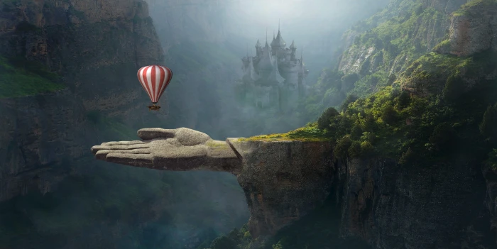 red and white striped hot air balloon above gray human hand mountain 17 2k 4k 5k