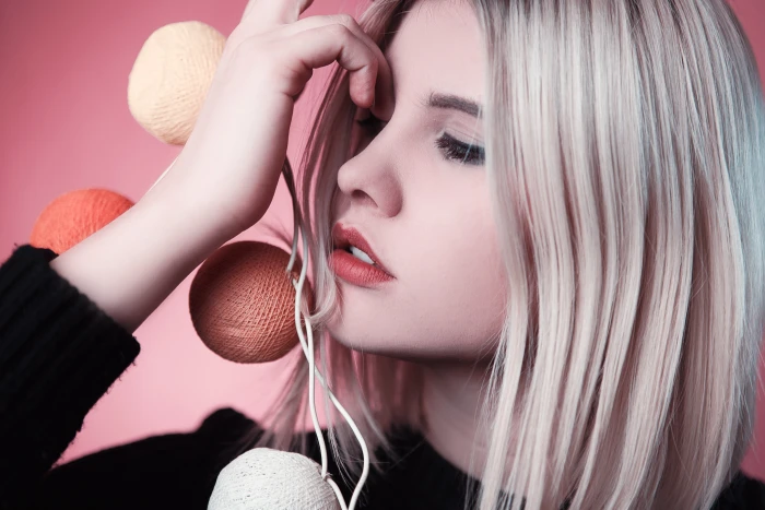 woman wearing black shirt holding yarn balls poster girl model 2k 4k 5k