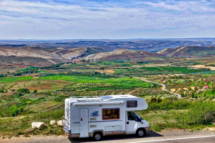 white RV on gray concrete road motorhome landscape journey 2k 4k 5k