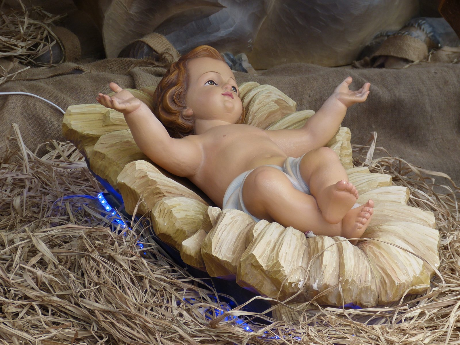 photography of baby Jesus ceramic figurine father christmas 2k 4k
