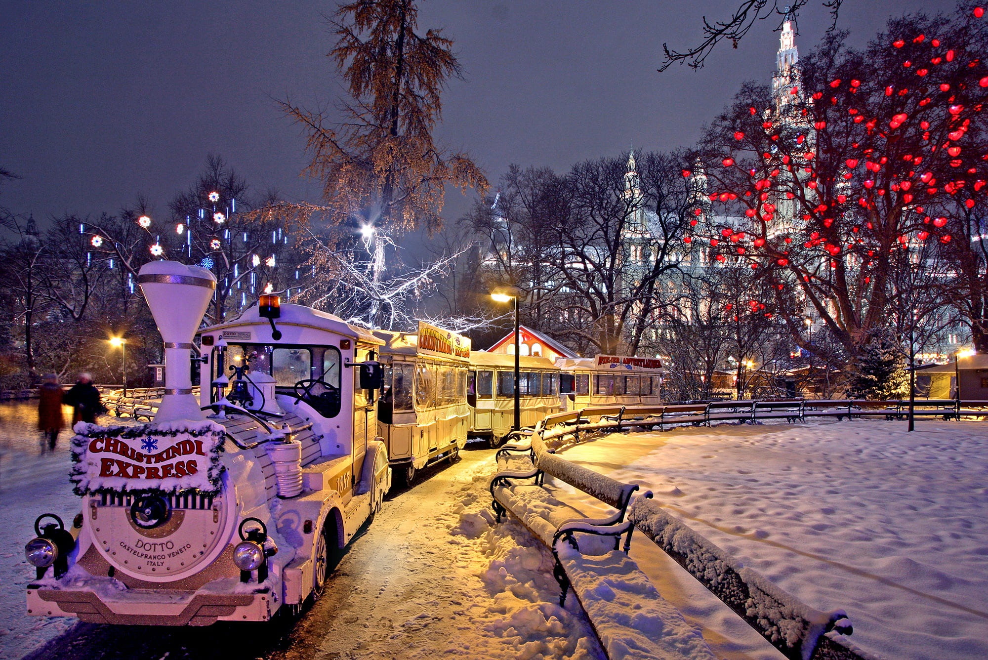 white train near metal railings vienna christmas market city hall park 2k
