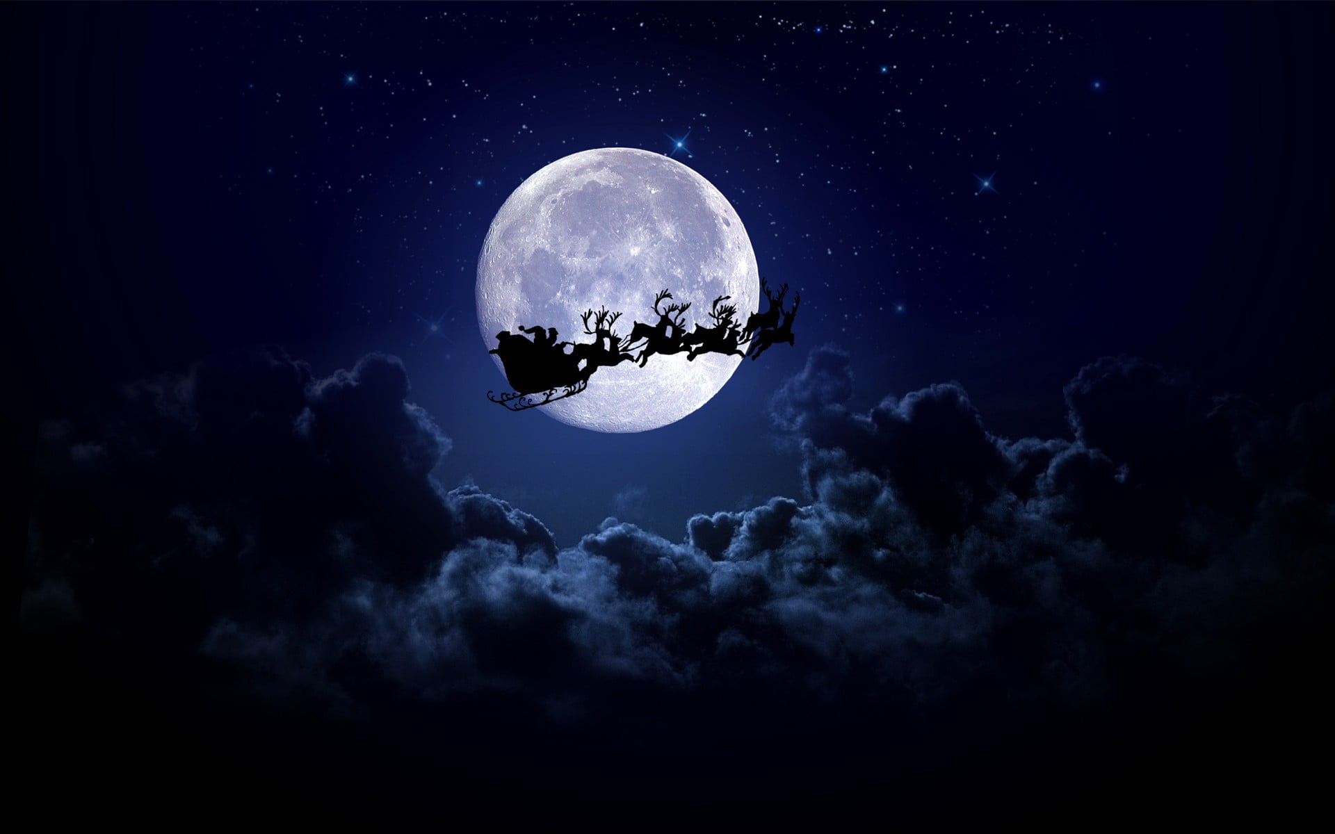 Santa Claus riding sleigh with reindeer wallpaper Christmas