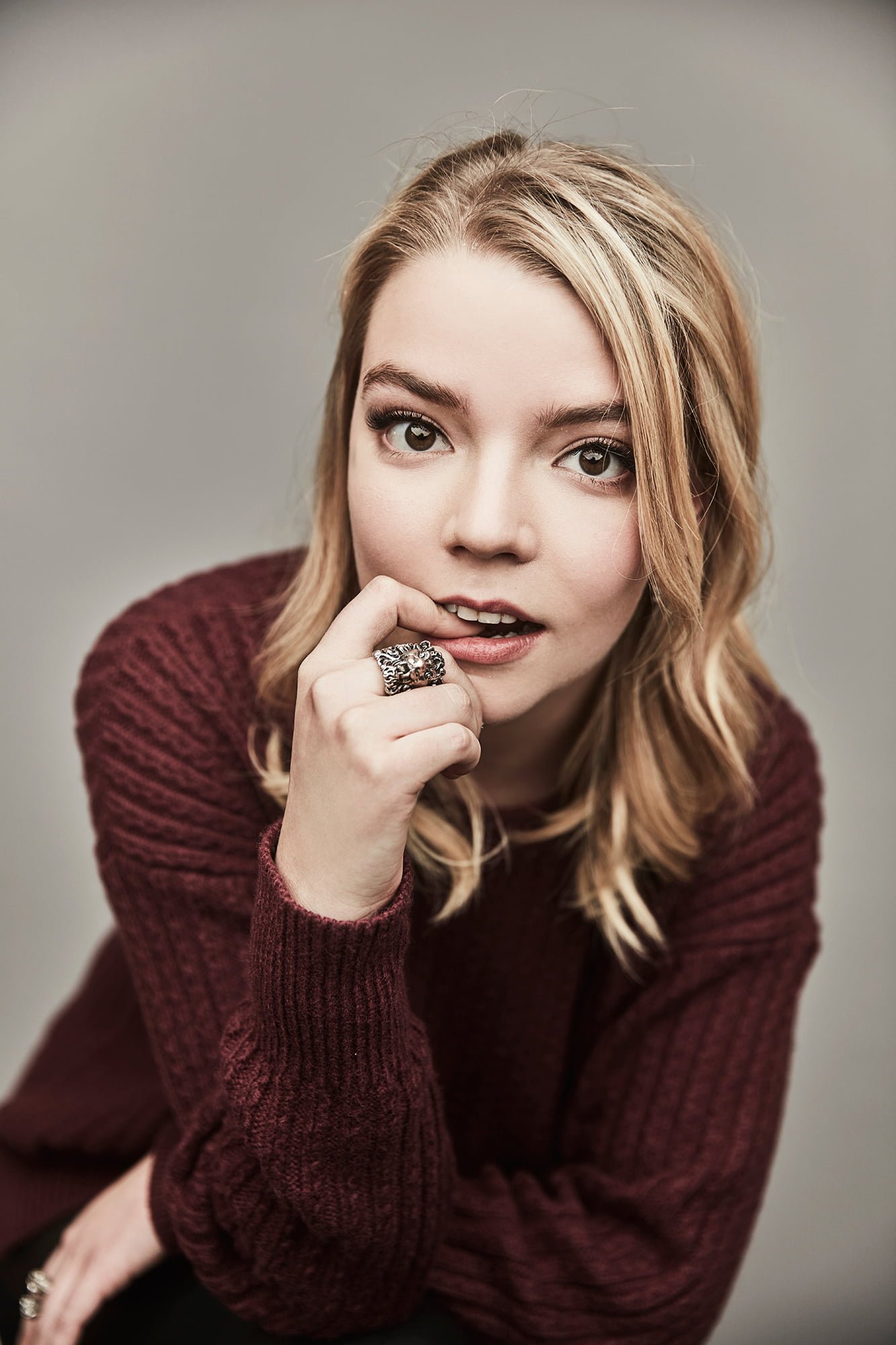 Anya Taylor Joy women actress blonde sweater simple background