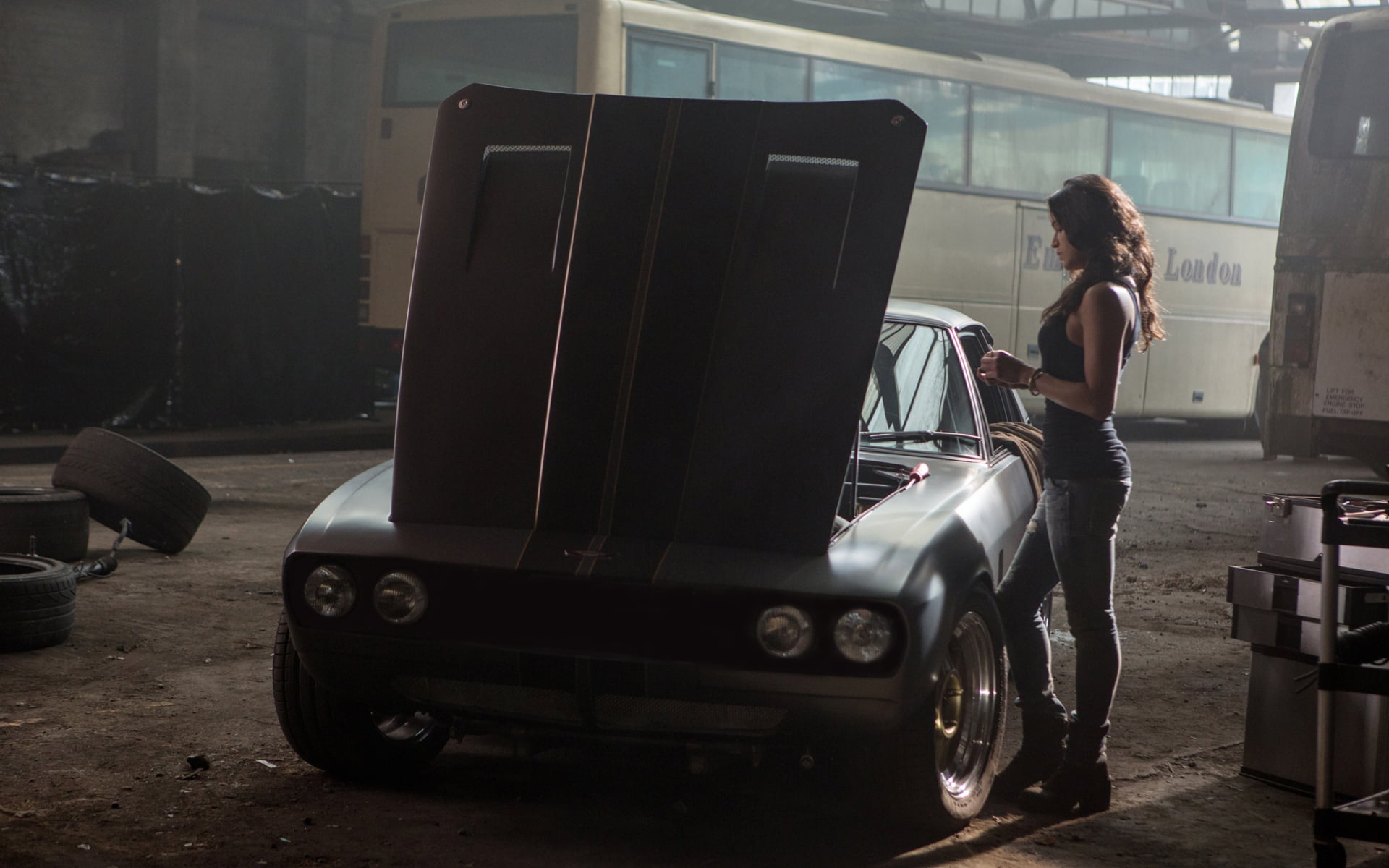 gray coupe machine background the film actress Michelle Rodriguez
