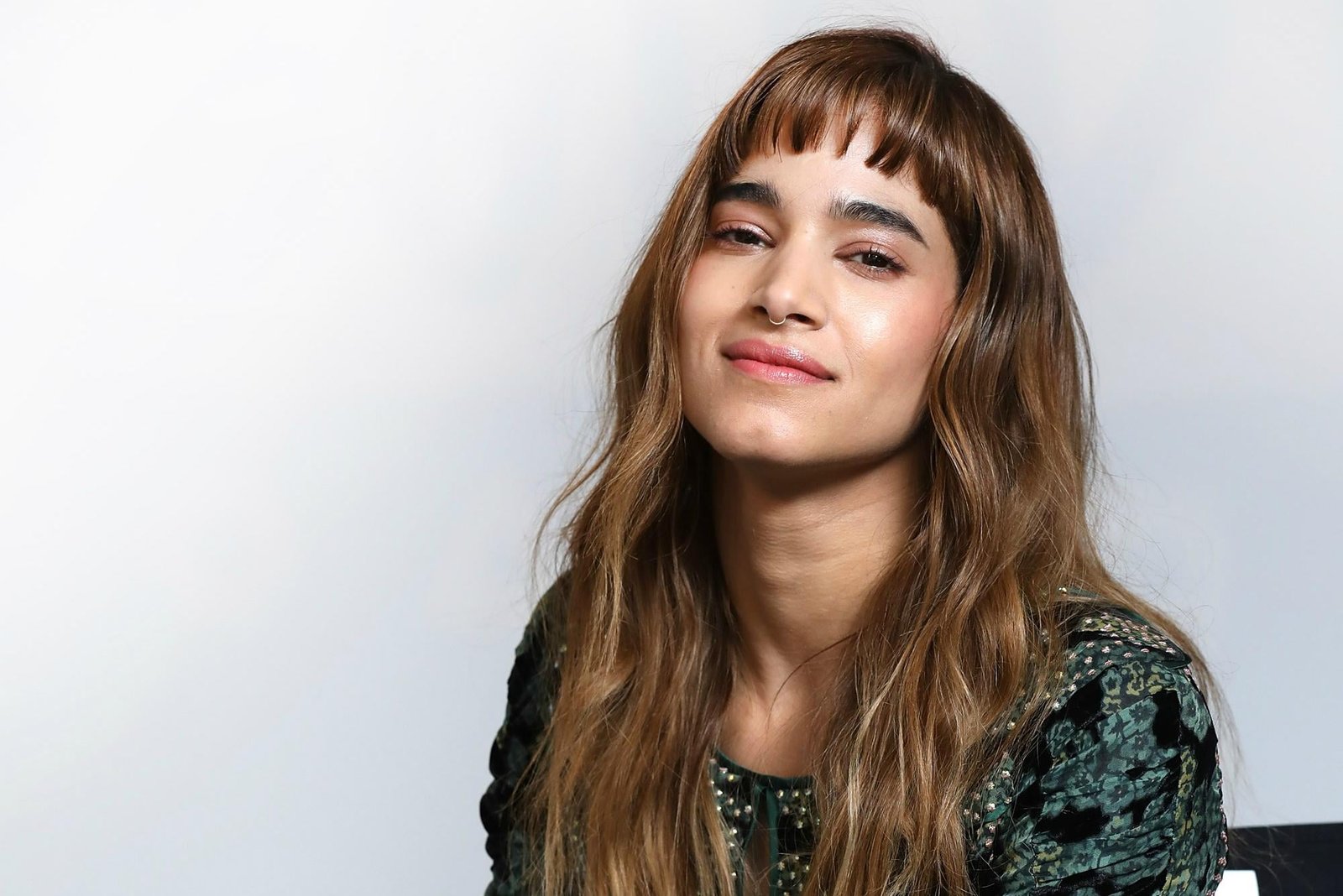 Sofia Boutella actress brunette brown eyes green top chair 2k