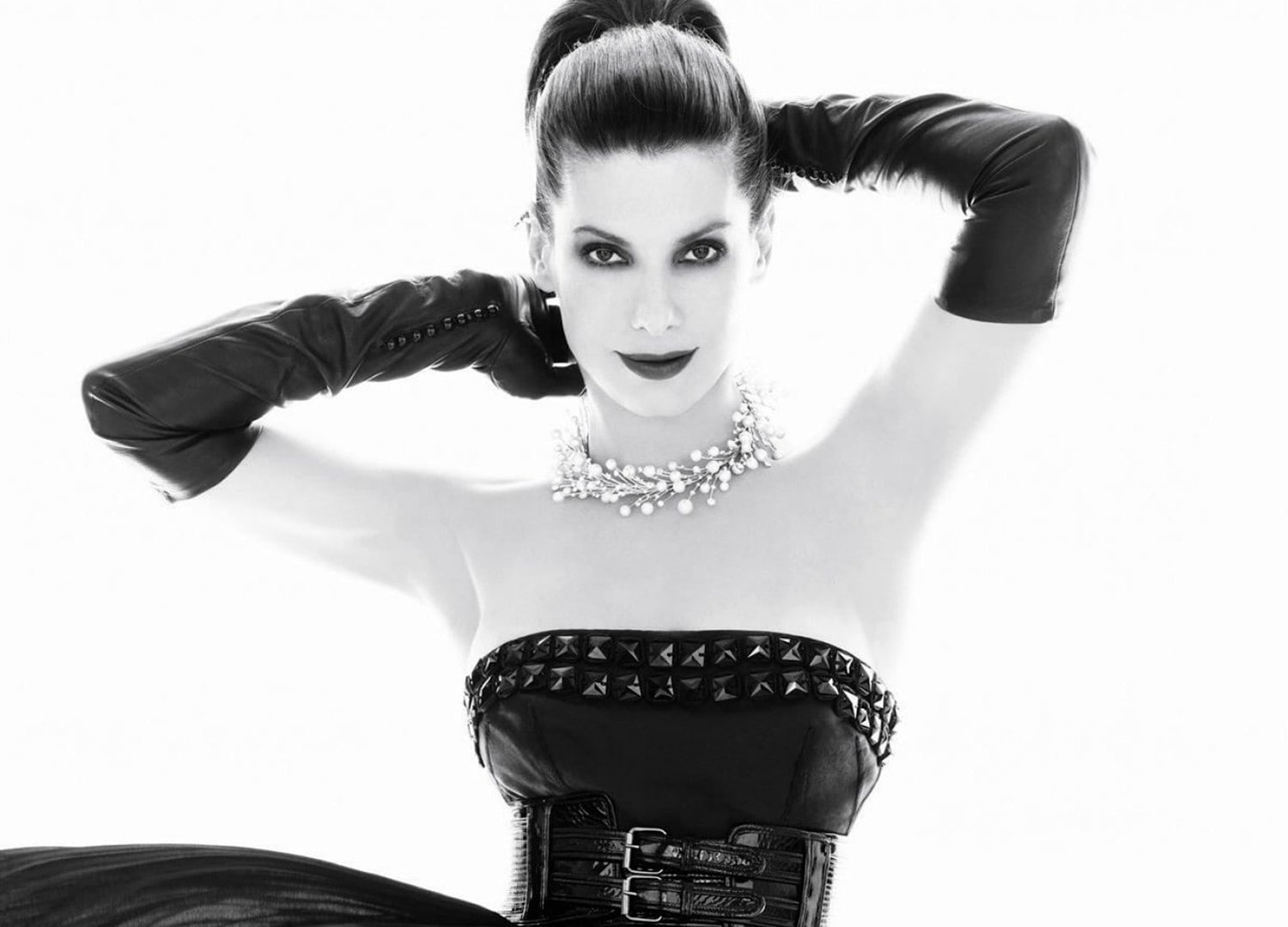 Sandra Bullock monochrome actress ponytail black gloves