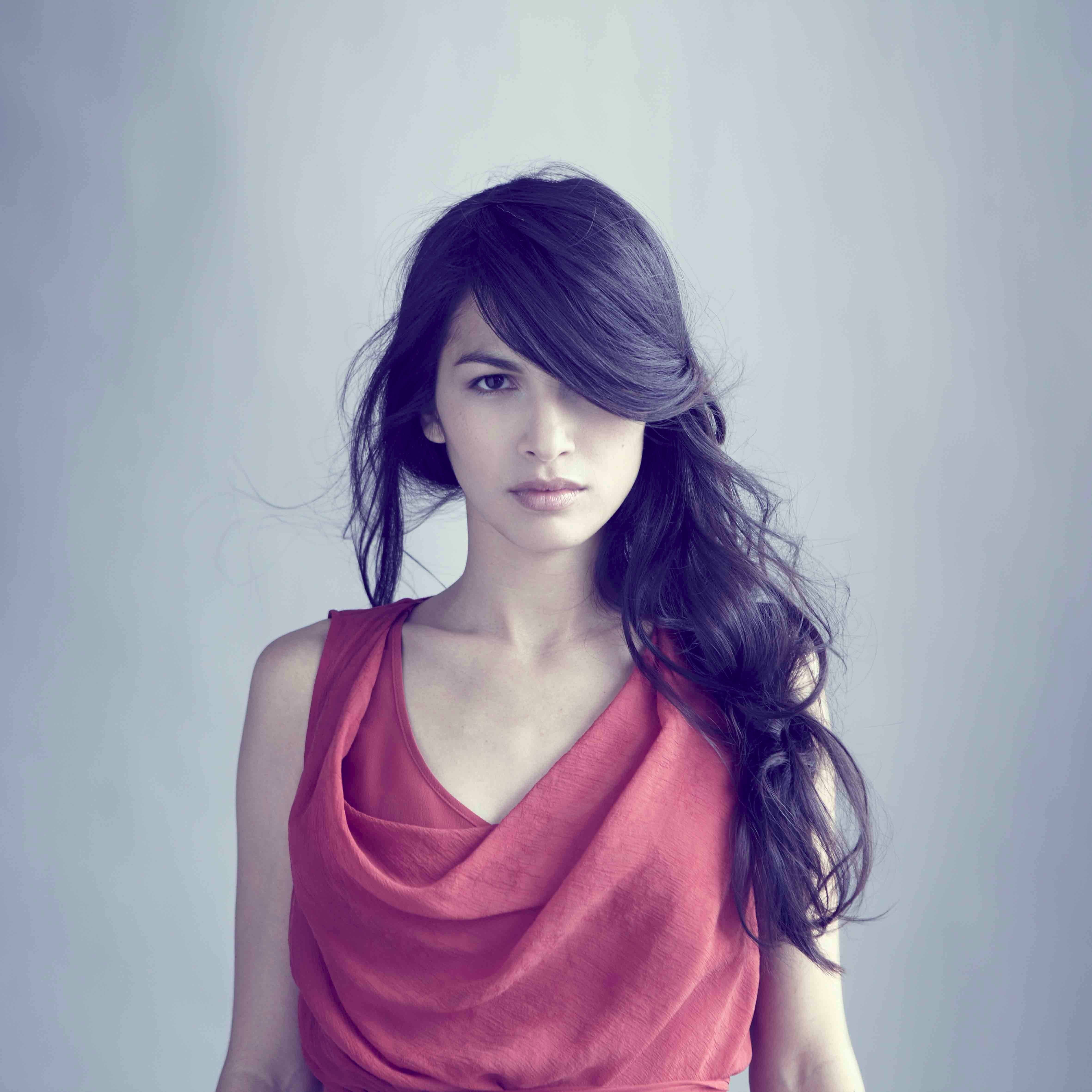 women actress brunette looking at viewer Elodie Yung simple background 2k 4k