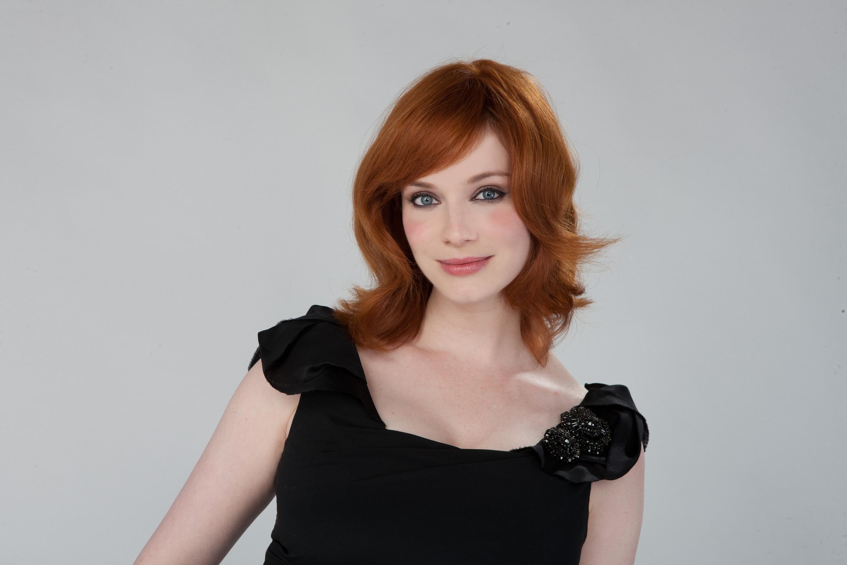 women actress Christina Hendricks redhead smiling simple background 2k