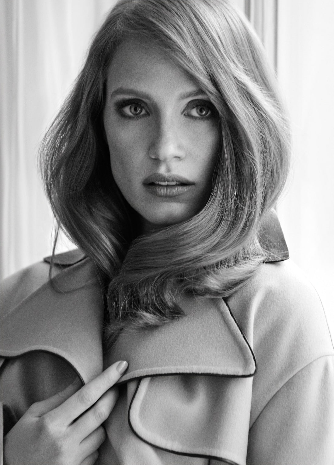 women actress Jessica Chastain white coat monochrome portrait