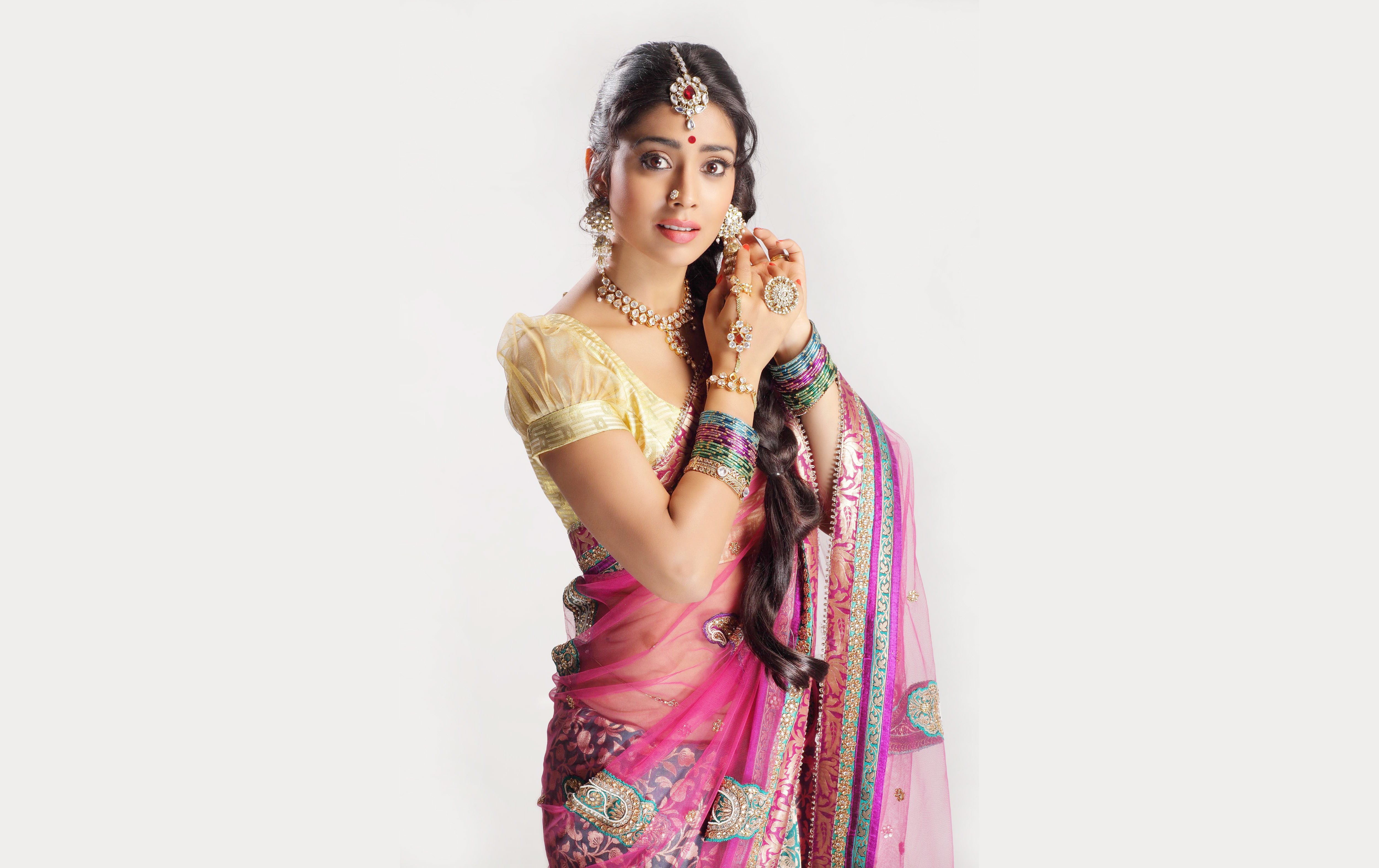 woman wearing beige and pink ghagra cholli traditional dress 2k 4k 5k