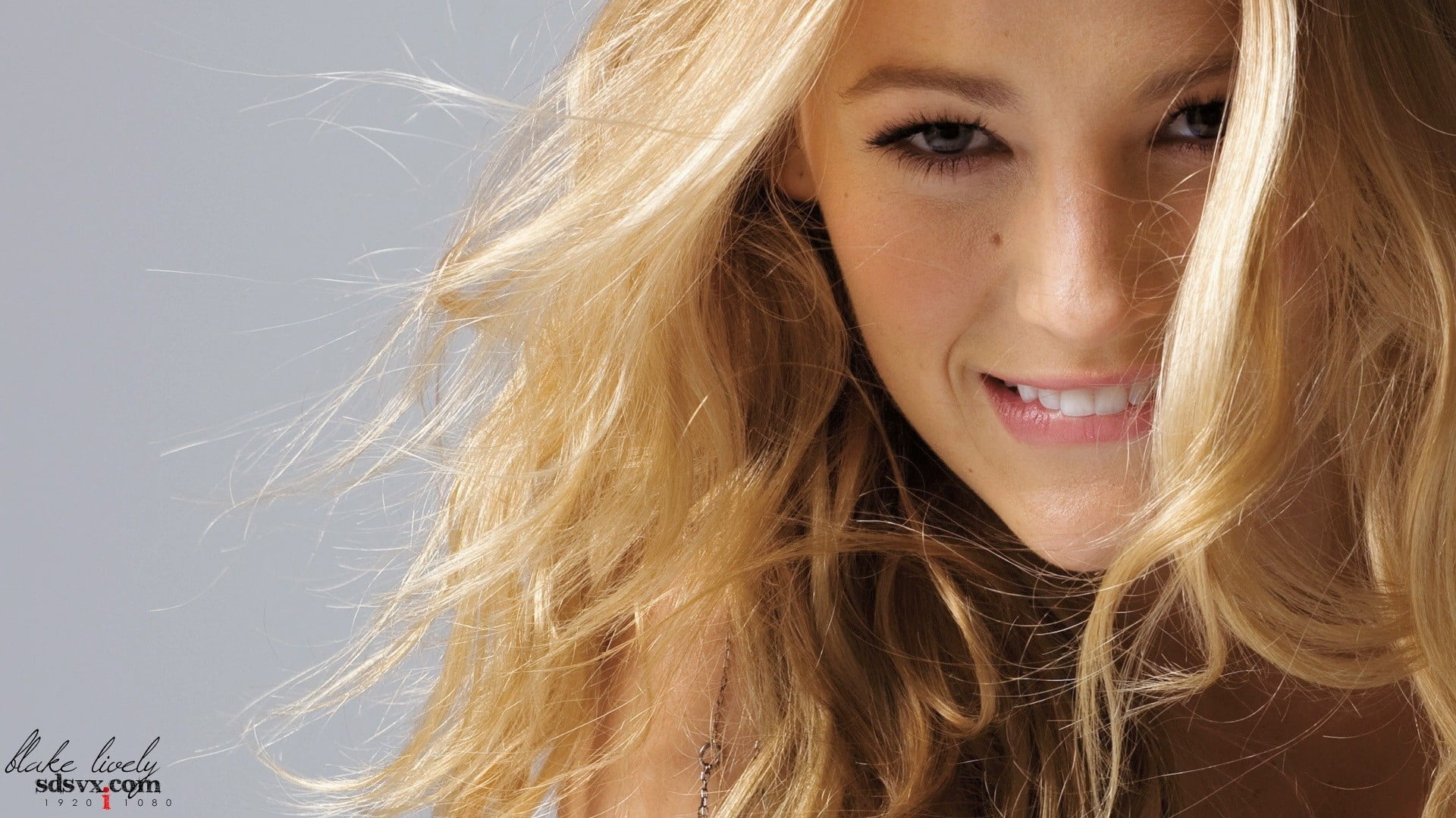 woman's face Blake Lively blonde curly hair biting lip women
