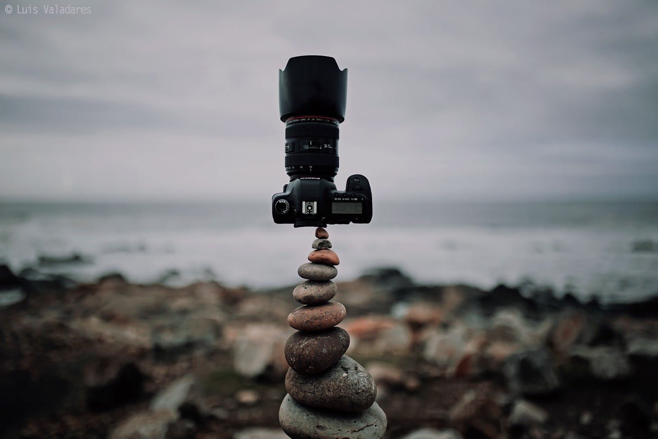 black DSLR camera photography nature symmetry rocks clouds