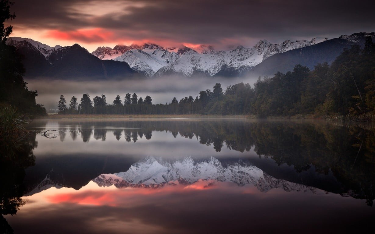 white snowcap mountains nature landscape mist lake sunset