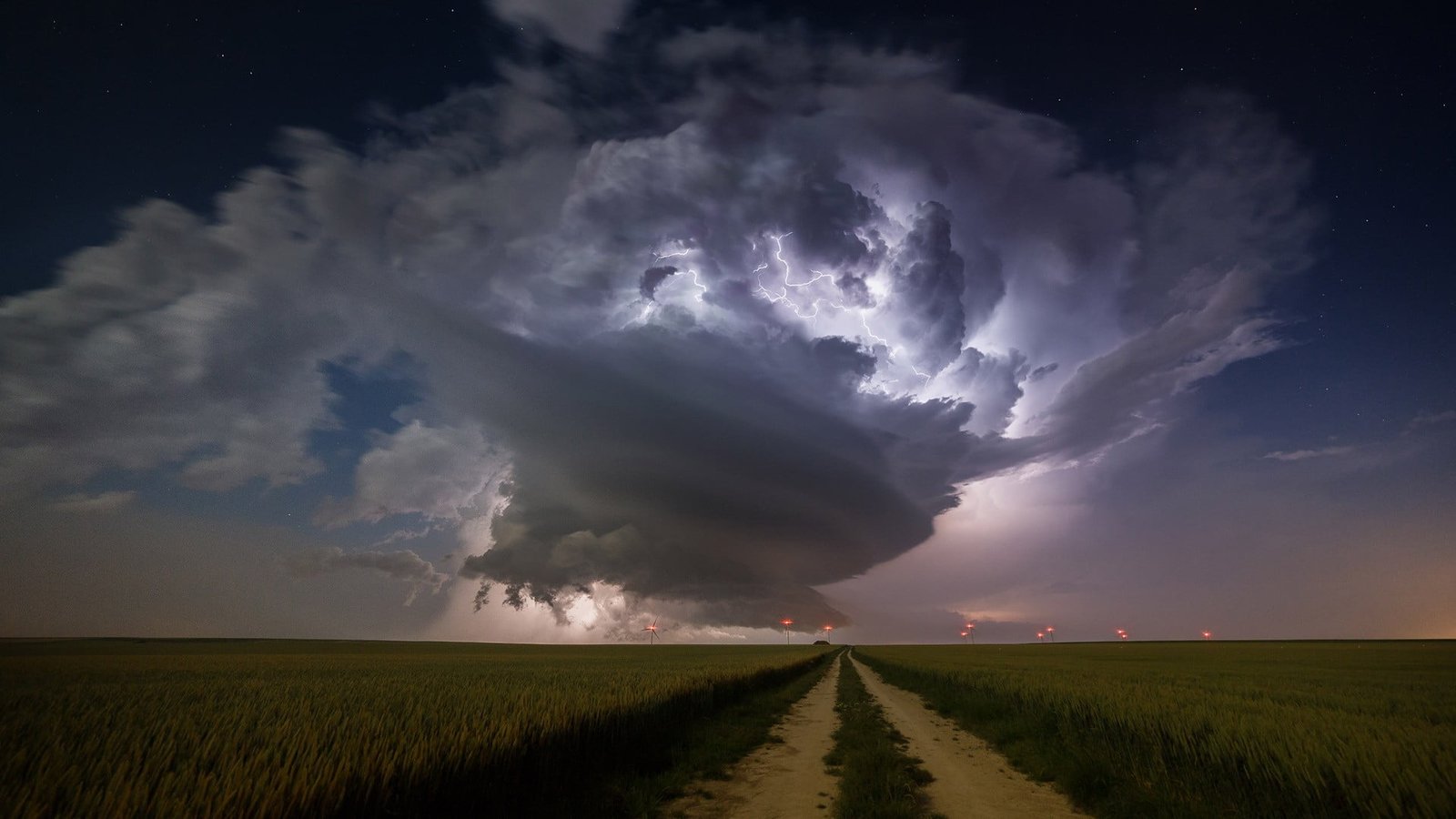 green grass field nature landscape clouds supercell 2k